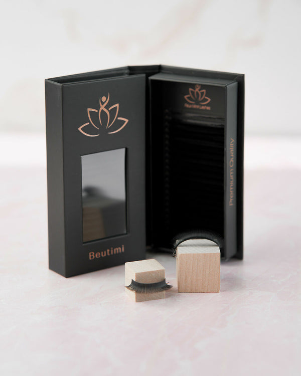Beutimi FauxMink Lashes 0.05MM displayed with black packaging featuring copper lotus logo and wooden application tools