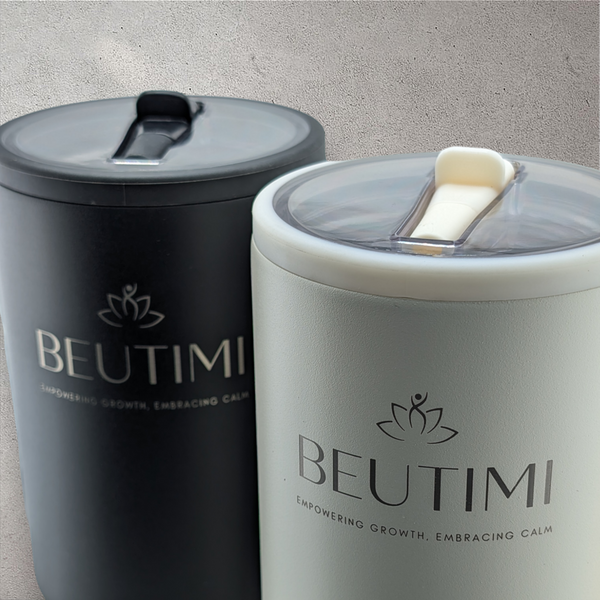 Two Beutimi Leakproof Hydroju g tumblers in black and cream with lotus logo and flip straws displayed side by side