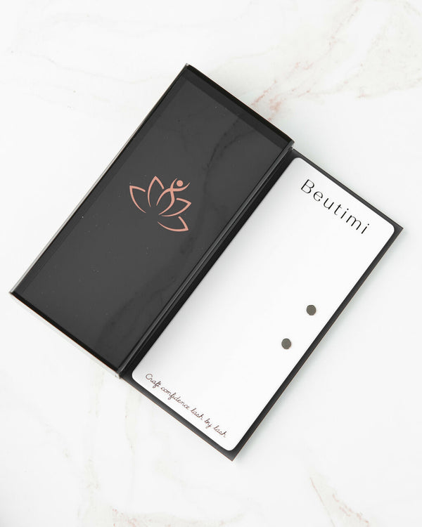 Beutimi Lash Visionary Tile displayed open in black packaging with rose gold lotus logo and white interior palette with magnetic tool holders