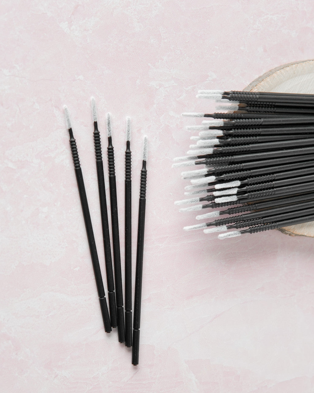 Beutimi Masterpiece Detailers micro brush applicators displayed in black with white tips, shown in 100-pack bundle on pink background