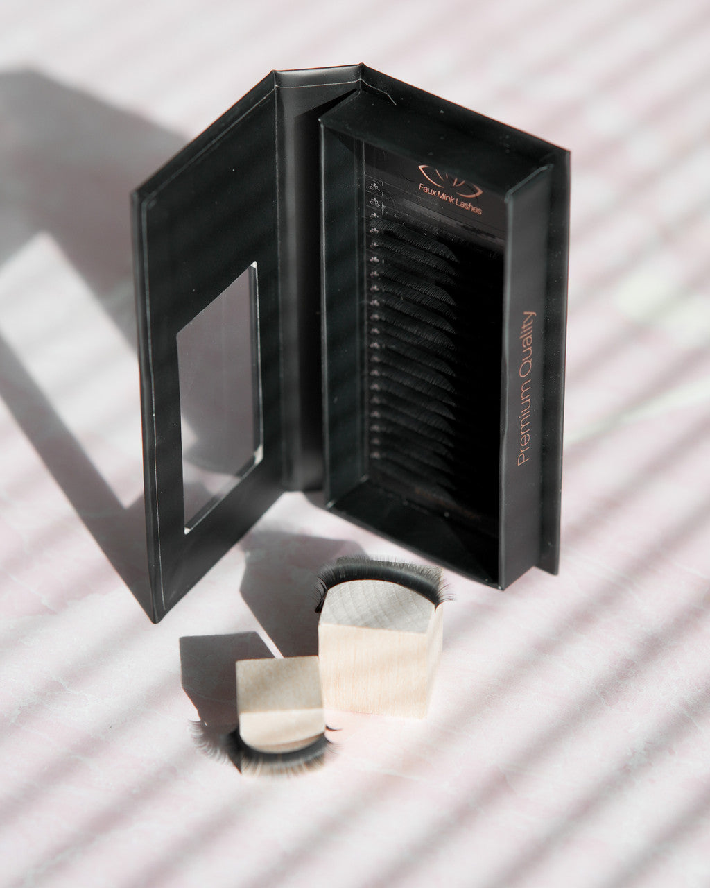 Beutimi FauxMink Lashes 0.03MM black packaging box open with cream applicator brushes displayed in front