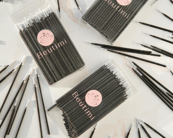 Beutimi Masterpiece Detailers 100-pack micro brush applicators displayed in black packaging with pink logo, surrounded by individual black brushes