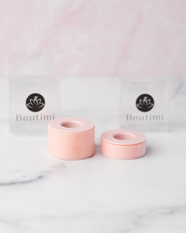 Beutimi Empower Gel Tape in pink with large and small rolls displayed alongside branded packaging on marble background