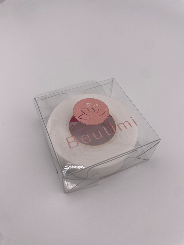 Round beauty product with 'Beutimi' branding in a clear box on a light gray background