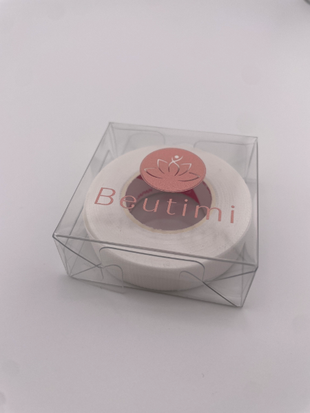 Round product in a clear box with 'Beutimi' branding on a white background