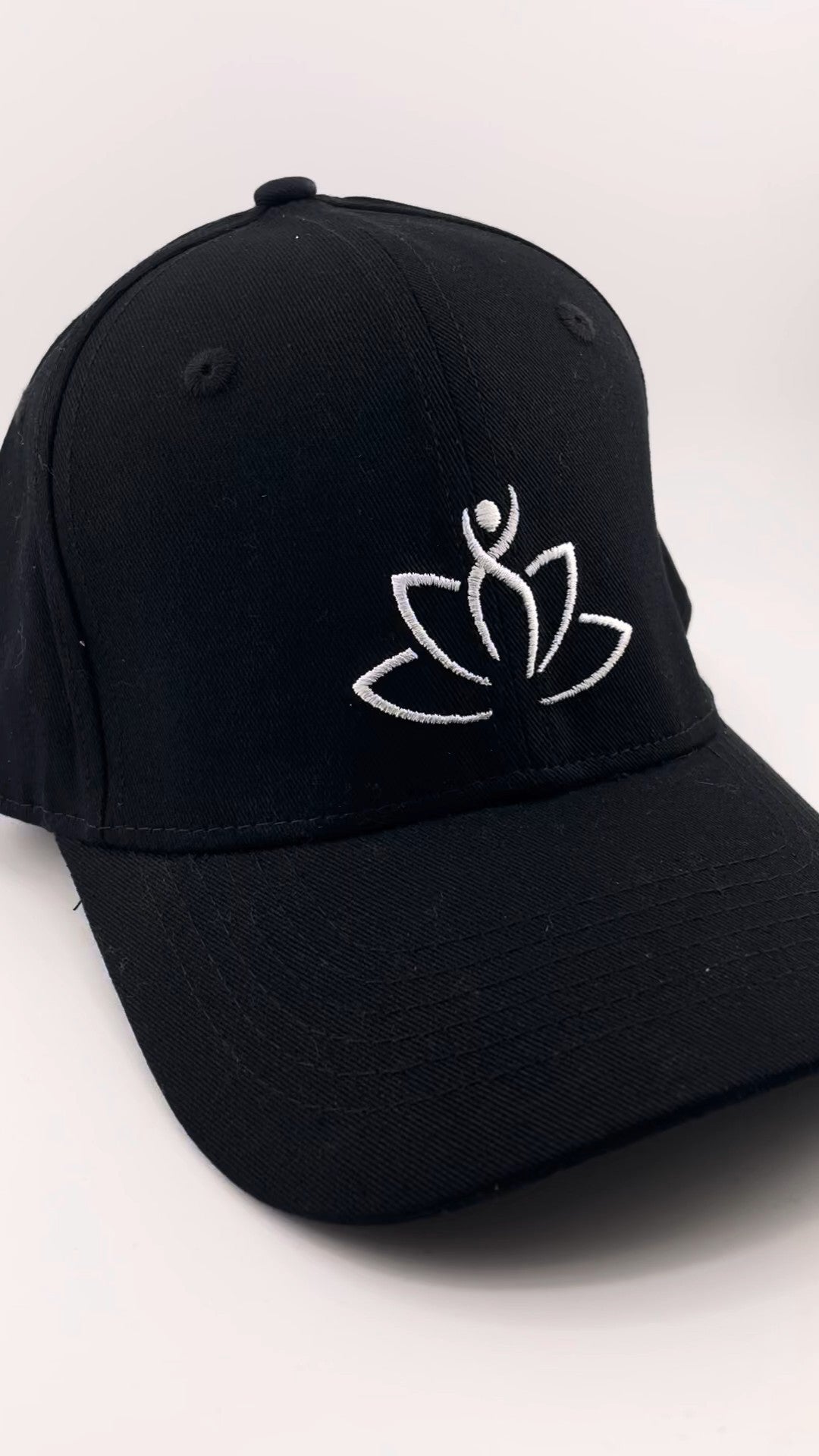 Black Beutimi Luxe Logo Hat – Limited Edition with white embroidered lotus flower logo and adjustable back strap