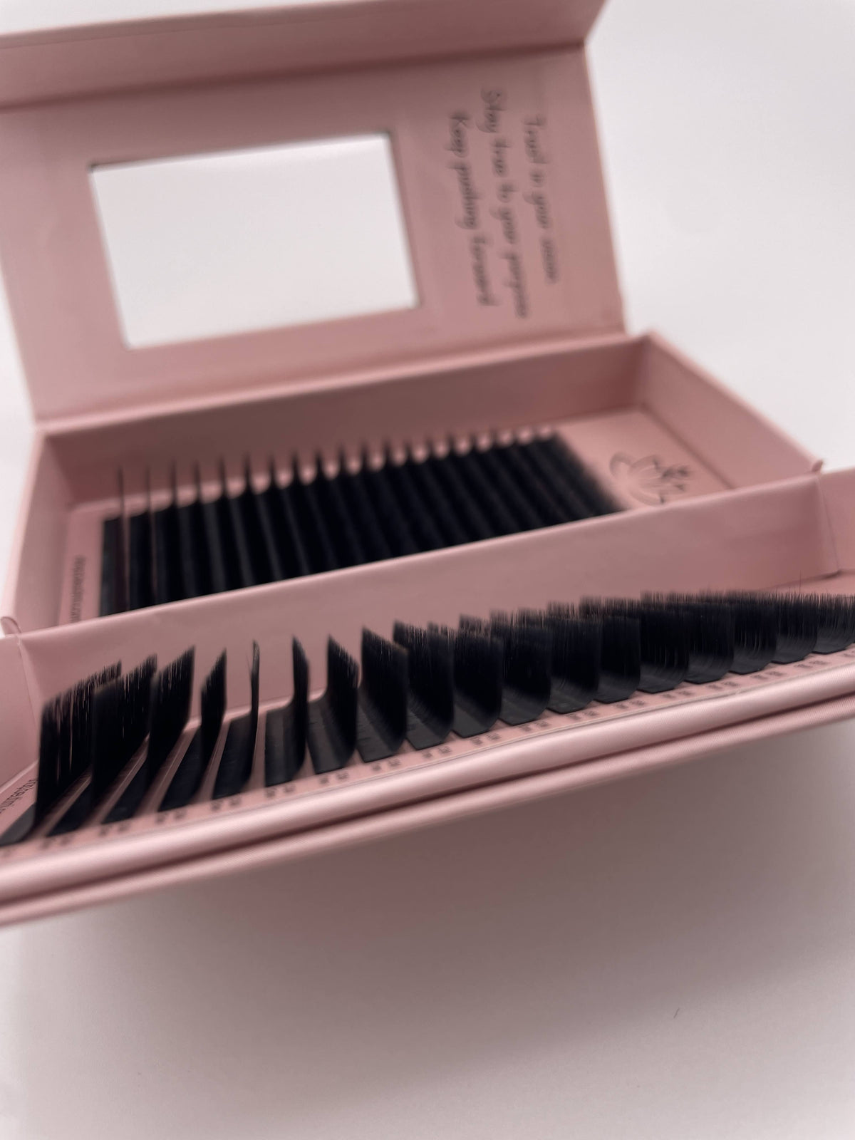 Beutimi FauxMink Lashes 0.03MM displayed in open pink packaging with black lash strips arranged in rows