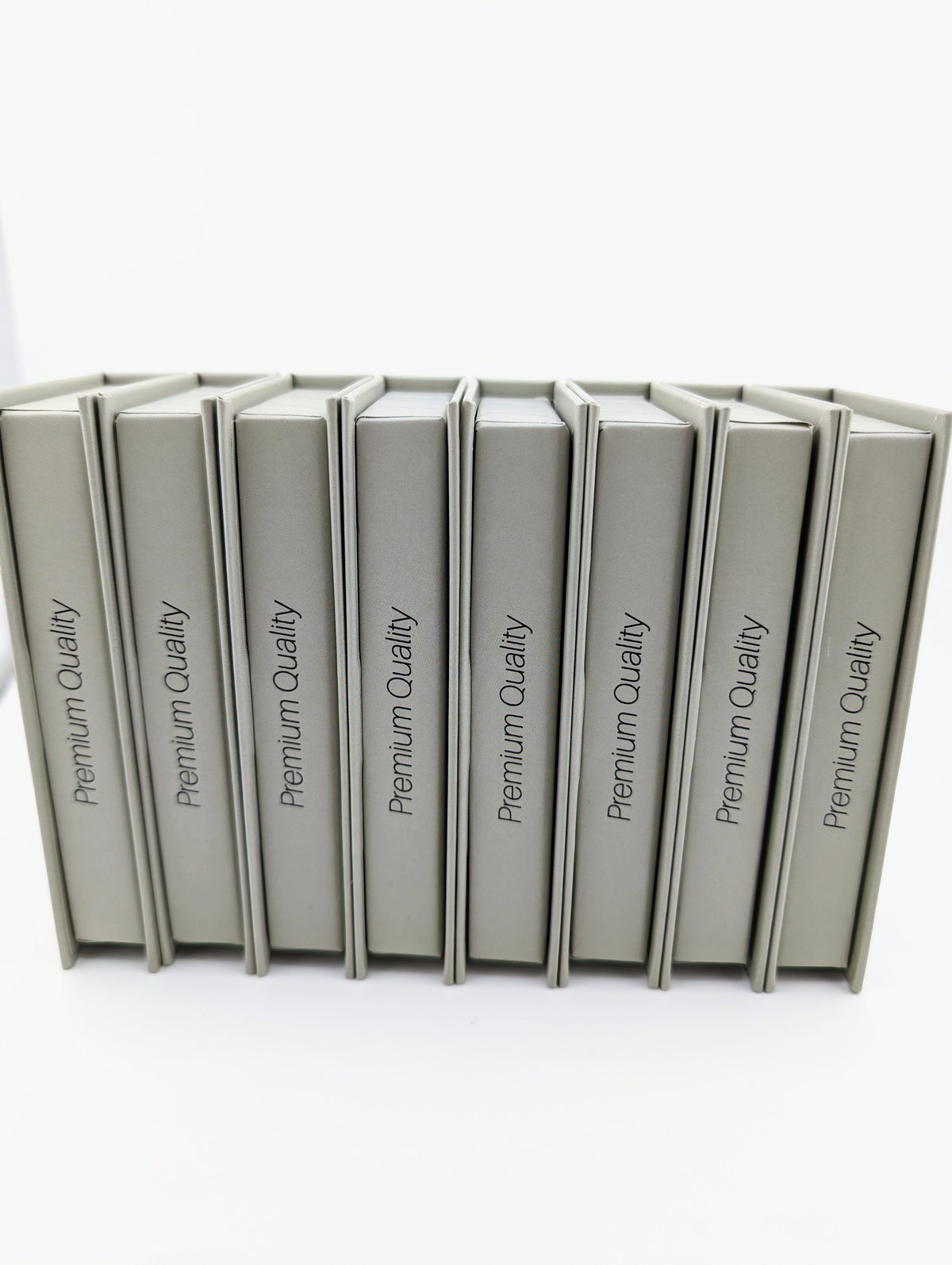 Eight sealed boxes of Beutimi Dark Brown FauxMink Lashes 0.03MM arranged in a row against white background