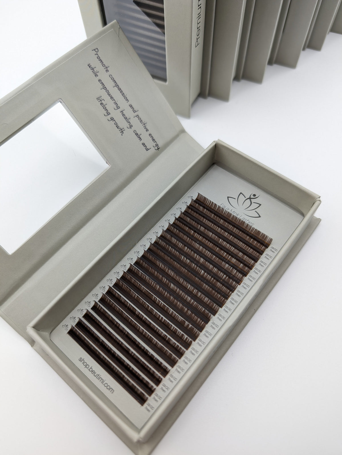 Beutimi Dark Brown FauxMink Lashes 0.05MM displayed in open white packaging tray with brown lash strips arranged in rows
