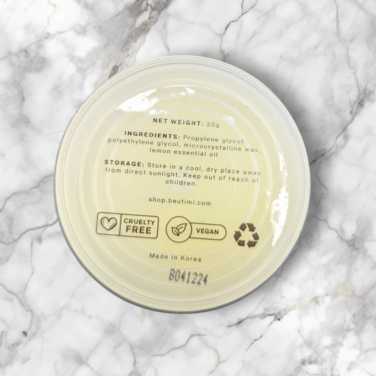 Beutimi Lemon Sherbet Lash Remover cream in pale yellow jar displayed on marble background showing ingredient label