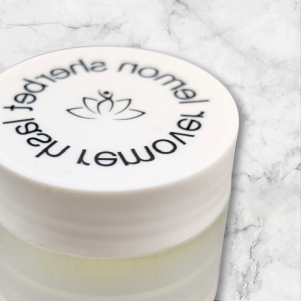 Beutimi Lemon Sherbet Lash Remover cream jar with lotus logo on white marble surface