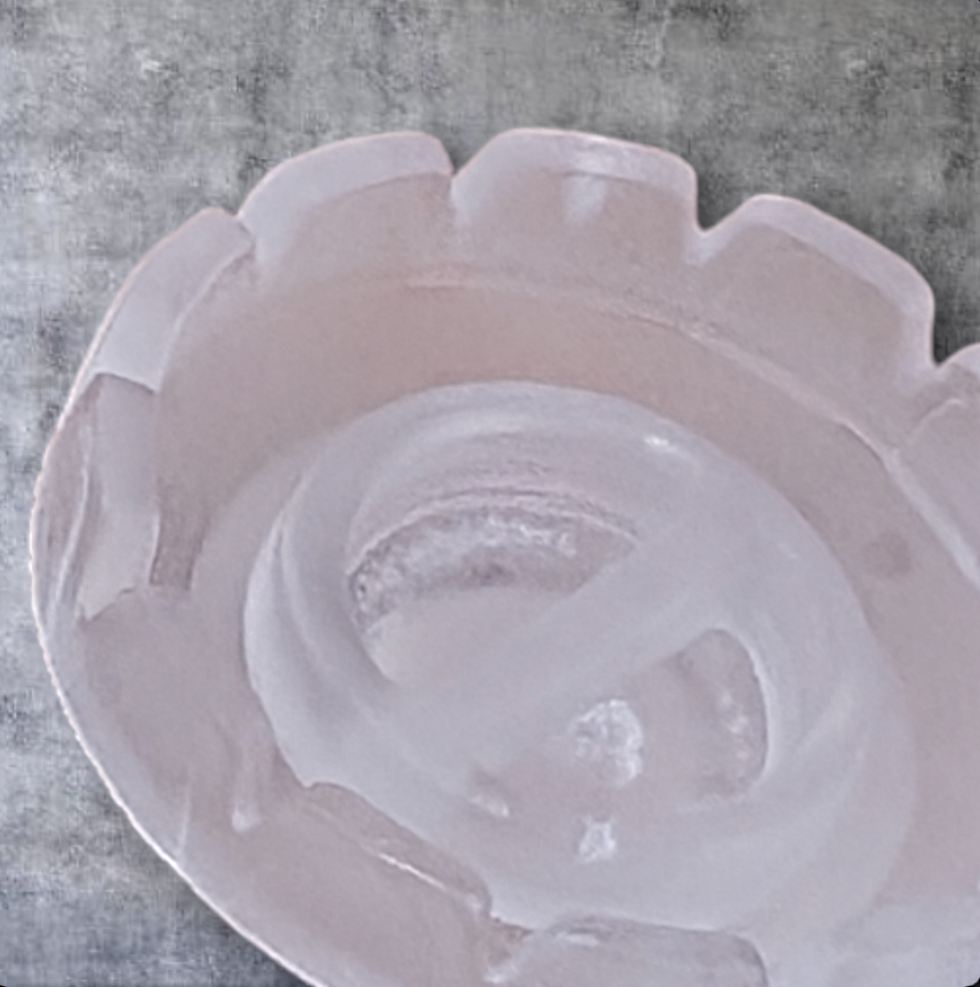 Beutimi Lotus Bouquet Ring displayed from above showing a translucent pale pink petal-shaped glue ring holder on gray surface