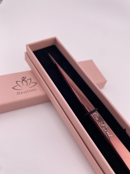 Beutimi On Point Tweezer displayed in rose pink packaging with black interior lining and fine-tipped tool visible